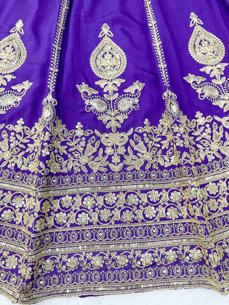 Royal Amethyst Purple Silk Lehenga Choli with Majestic Gold Zari Heritage Motifs and Elaborate Borders